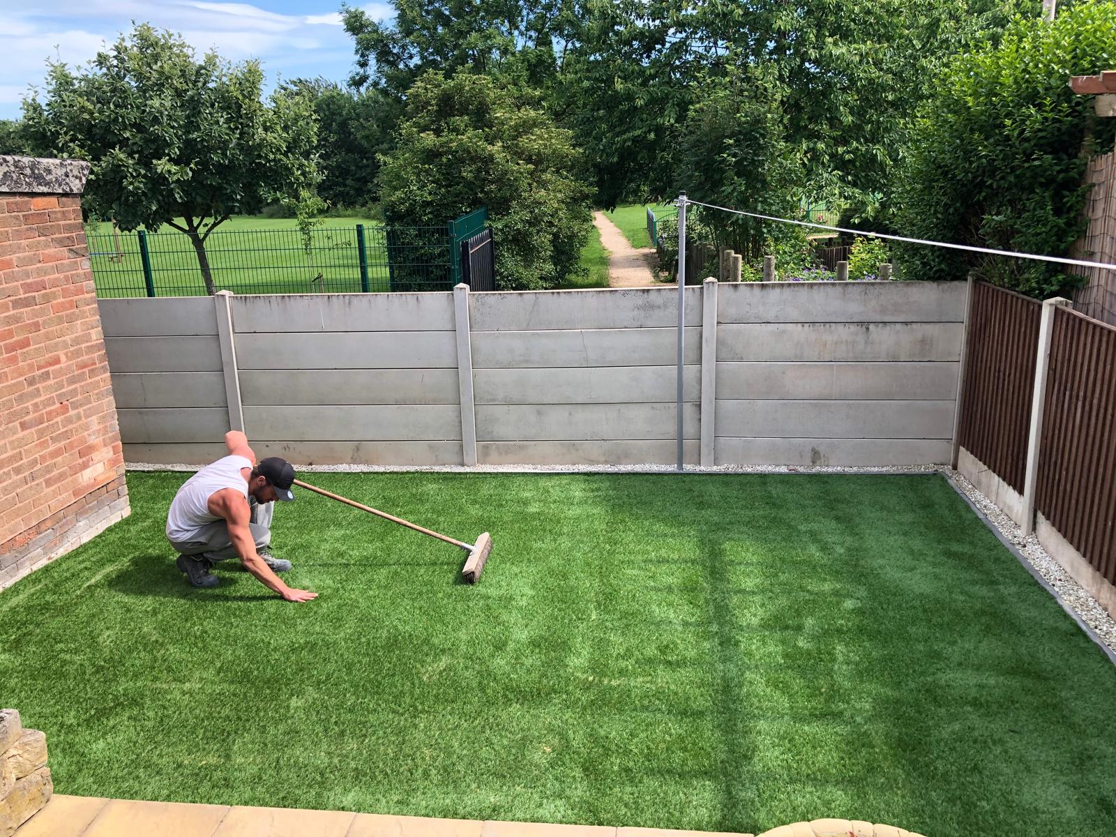 Artificial grass brushing in